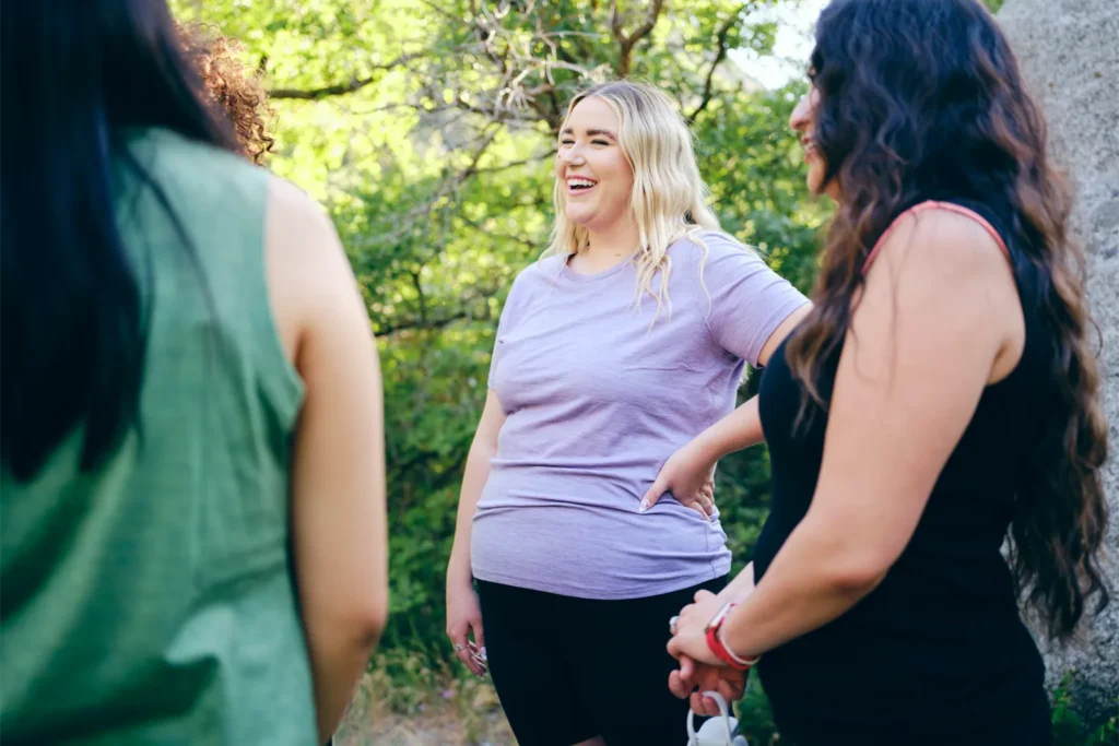 Group of happy women hiking outdoors.